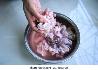 Washing And Cleaning Raw Chicken Meat With Hand For Healthy And Hygiene 