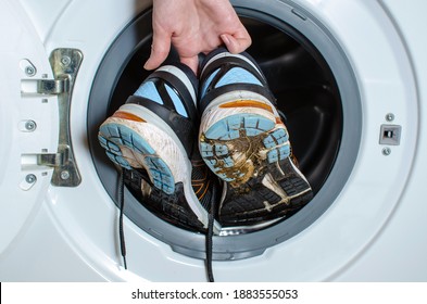 Washing Dirty Sneakers In The Washing Machine. Cleaning Trail Running Shoes