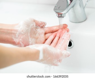 Washing Of Female Hands With Soap In Bathroom Close Up