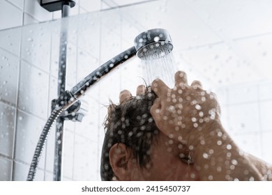 Washing hair with shampoo. Man in shower. Cold or hot water. Conditioner, gel or foam. Hairline, loss, dandruff or damage concept. Dry itchy scalp. Healthy happy male in gym or hotel bath. - Powered by Shutterstock