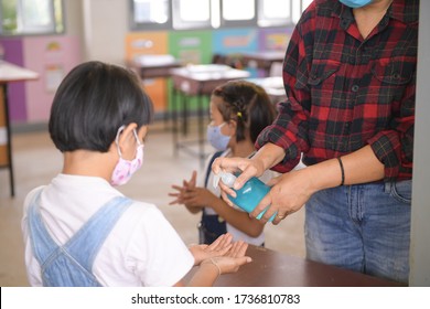 Washing Hand By Sanitizer Gel For Prevention Coronavirus Disease (Covid-19) in classroom.Washing hands by alcohol sanitizers or alcohol gel from pump bottle in public area.  - Powered by Shutterstock