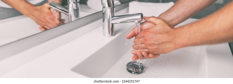 Washing Hands In Hot Water At Sink Man Home Lifestyle Panoramic Banner Background.