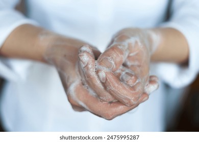 Washing hands. Rubbing with a soap. Close-up. Hand hygiene to reduce the spread of infections. Handwashing to stop spreading coronavirus and other infections. - Powered by Shutterstock