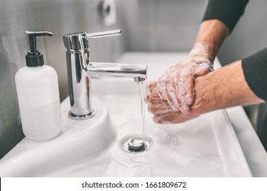 Washing hands rubbing with soap man for corona virus prevention, hygiene to stop spreading coronavirus. - Shutterstock ID 1661809672