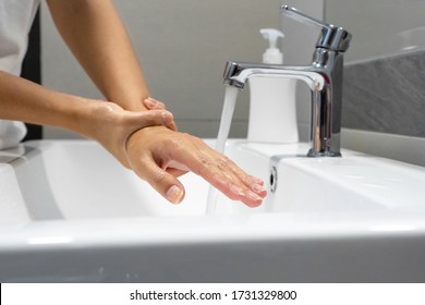 Washing hands rubbing with soap woman for corona virus prevention, hygiene to stop spreading coronavirus. - Shutterstock ID 1731329800