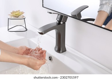 Washing hands under the flowing water tap. Washing hands rubbing with soap for corona virus prevention, hygiene to stop spreading corona virus in or public wash room. Hygiene concept hand detail - Powered by Shutterstock