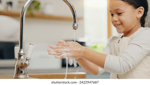 Washing hands, water and happy girl child in kitchen for hygiene, safety or responsibility at home. Smile, cleaning and female kid at a sink for palm scrub, learning and care, bacteria or prevention - Powered by Shutterstock