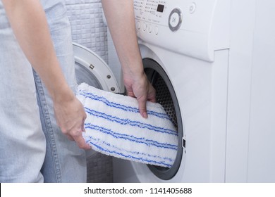 Washing Head Of Cleaning Mop In Washer After Cleaning House