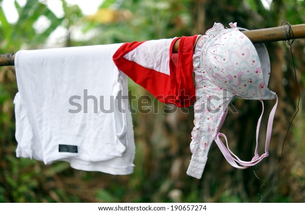 Washing hung out to dry in\
the jungle