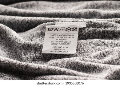 Washing Instructions On Gray Fabric Clothes Label
