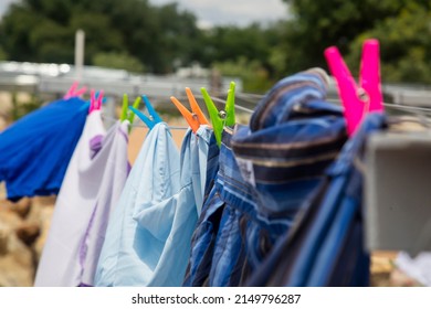 Washing Line With Clothes Drying  In The Backyard