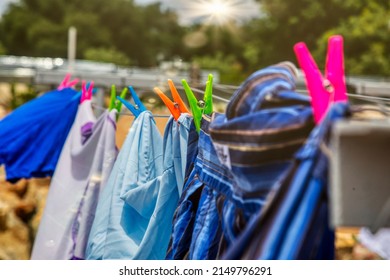 Washing Line With Clothes Drying  In The Backyard