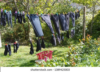 Washing Line With Clothes Drying In A Garden