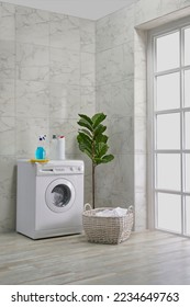 Washing machine in the bath room, cleaning kits, corner style, decorative object, towel, brush, dirty clothes. - Shutterstock ID 2234649763