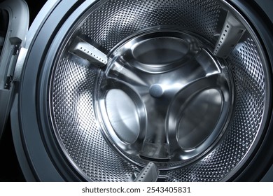 Washing machine with empty drum as background, closeup