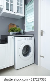 washing machine in a kitchen room - Shutterstock ID 517227385