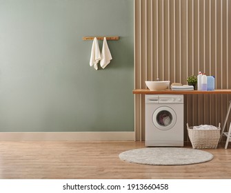 Washing Machine In The Laundry Room Style, Interior Concept, Dirty Clothes Decor Coffee Table With Vase Of Plant. Wooden Bench, Sink And Towel.