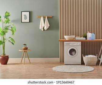 Washing Machine In The Laundry Room Style, Interior Concept, Dirty Clothes Decor Coffee Table With Vase Of Plant. Wooden Bench, Sink And Towel.