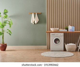 Washing Machine In The Laundry Room Style, Interior Concept, Dirty Clothes Decor Coffee Table With Vase Of Plant. Wooden Bench, Sink And Towel.