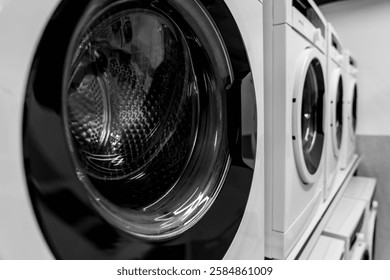 Washing machines, tumble dryer in a laundromat. industrial laundry equipment, energy efficient appliances, commercial laundry solutions, sustainable washing technology, hygienic washing environment