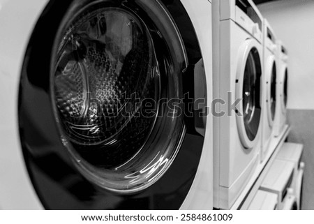 Washing machines, tumble dryer in a laundromat. industrial laundry equipment, energy efficient appliances, commercial laundry solutions, sustainable washing technology, hygienic washing environment