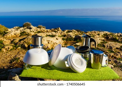 Washing Up On Fresh Air. Adventure, Camping On Nature, Dishwashing Outside. Clean Dishes Drying On Dish Mat.