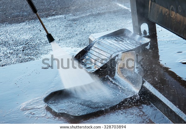 Washing rubber carpets in a\
car wash