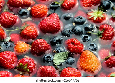 washing strawberries blueberries in bicarbonate underwater