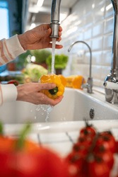 Washing Of Yellow Pepper Under Tap Water Closeup. Tasty Raw Sweet Fresh Vegetable Full Of Vitamins, Ingredient Used For Salad Cooking. Organic Vegetarian Food. Natural Nutrition For Good Health, Detox