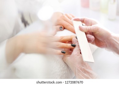 Washing Your Nails. Removal Of Hybrid Varnish With A Nail File.