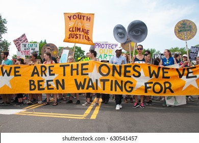 WASHINGTON APRIL 29: Protesters at the People’s Climate March highlight the need to take action on climate change in Washington DC on April 29, 2017, President Trump’s 100th day in office. 