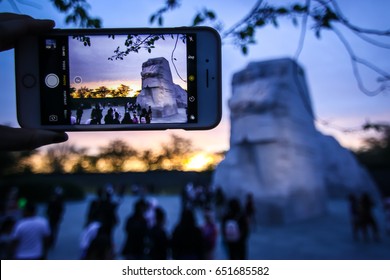 Washington, DC - April 10, 2017: A Tourist Takes A Photo Of The Martin Luther King, Jr. Memorial. 