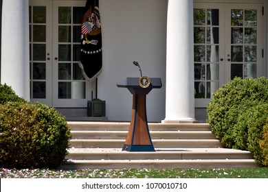 WASHINGTON, DC - APRIL 14, 2018: The presidential podium is seen in the Rose Garden of the White House on a clear sunny day during the Spring Garden Tour.