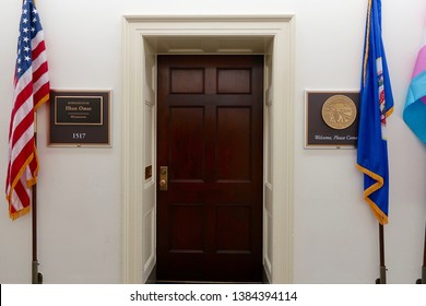 WASHINGTON, DC - APRIL 26, 2019: US HOUSE REPRESENTATIVE Ilhan Omar - Office Entrance With Sign And Flags