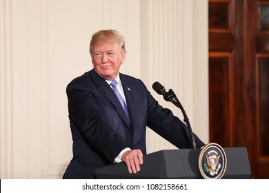 Washington, DC - April 27, 2018: US President Donald Trump speaks at a press conference in the East Room of the White House alongside German Chancellor Angela Merkel. 