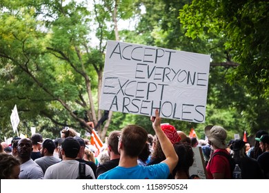 WASHINGTON, DC - AUGUST 13, 2018: An Activist In DC Holds A Protest Sign That Says 