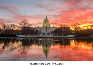 Washington DC, Capitol Building In A Cloudy Sunrise With Mirror Reflection