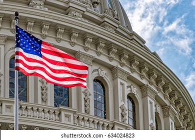 Washington DC Capitol dome detail with waving american flag - Shutterstock ID 634024823