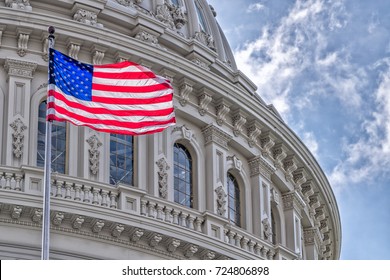 Washington DC Capitol dome detail with waving american flag - Shutterstock ID 724806898