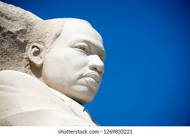 WASHINGTON DC - CIRCA AUGUST, 2018: The Stone Portrait At The Martin Luther King, Jr Memorial Looks Out In Profile Against Clear Blue Sky.