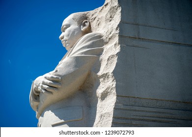 WASHINGTON, DC - CIRCA SEPTEMBER, 2018: The Stone Portrait Of MLK Looks Out In Profile Under Bright Blue Sky At The National Dr Martin Luther King, Jr Memorial.