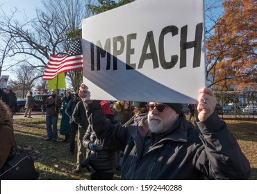 WASHINGTON, DC - DEC. 18, 2019: Some of hundreds at rally to support the impeachment of President Donald Trump at U.S. Capitol on day of House of Representatives vote on articles of impeachment.