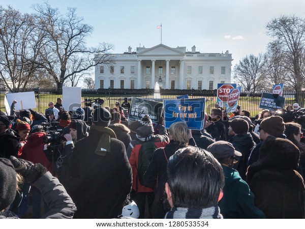 WASHINGTON, DC – JAN. 10, 2019: White House\
protest over government shutdown by furloughed as well as unpaid\
working federal employees, union members, contractors and\
supporters after rally at\
AFL-CIO