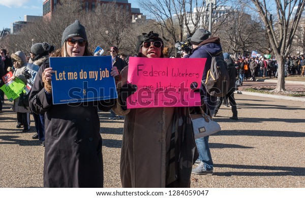 WASHINGTON, DC – JAN. 10, 2019: Protest of\
government shutdown by furloughed as well as unpaid federal\
employees, union members, contractors and supporters march to White\
House from rally at\
AFL-CIO.