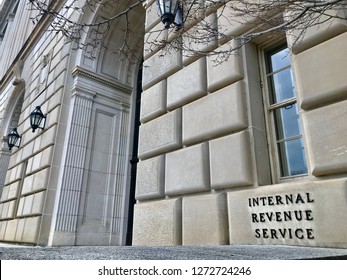 WASHINGTON, DC - JANUARY 1, 2019: IRS - INTERNAL REVENUE SERVICE Sign At Headquarters Building Entrance.