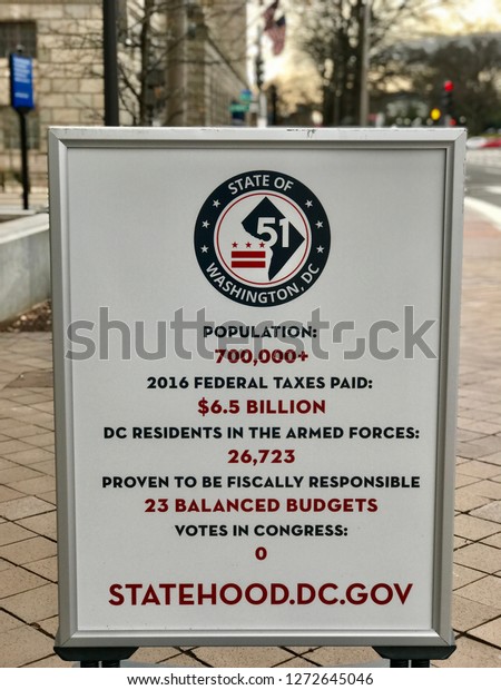 WASHINGTON,\
DC - JANUARY 1, 2019: DC GOVERNMENT supports statehood. Sign at\
GOVERNMENT OF THE DISTRICT OF COLUMBIA headquarters office building\
provides information supporting DC\
statehood.