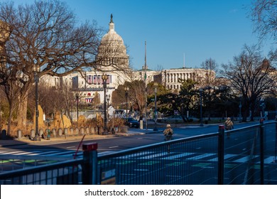 Washington, DC – January 19, 2021: National Guard Troops And Police Guarding The Perimeter Security Fence At The U.S. Capitol And National Mall Day Before Joe Biden Inauguration.