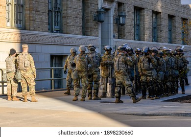 Washington, DC – January 19, 2021: National Guard Troops And Police Guarding The Perimeter Security Fence At The U.S. Capitol And National Mall Day Before Joe Biden Inauguration. Riot Control. Ready.
