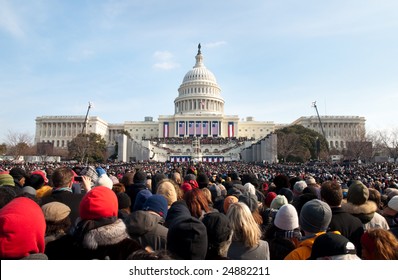 WASHINGTON, DC - JANUARY 20, 2009: A crowd of warmly dressed onlookers attends the 2009 inauguration of President Barack Obama, America's first African American president.