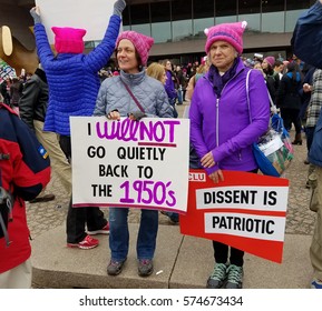WASHINGTON, DC - JANUARY 21, 2017: Protesters hold up anti-Trump signs as thousands participate in the Women's March on Washington for social justice, the day after the Presidential Inauguration.